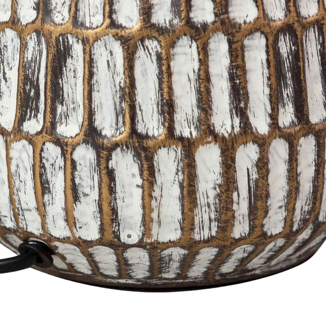 Close-up detail of the dark ceramic base showing the contrast between the glazed texture and darker finish.