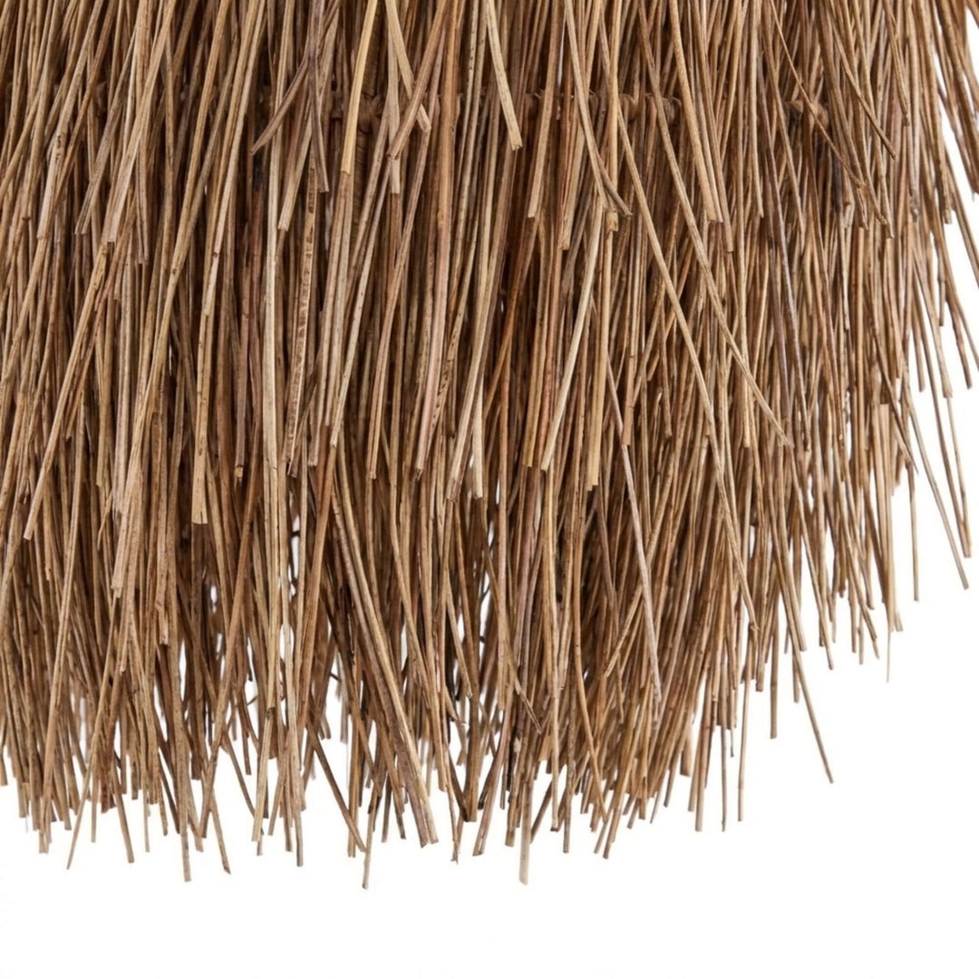 Detail view highlighting the natural fiber fringe texture and handcrafted finish.