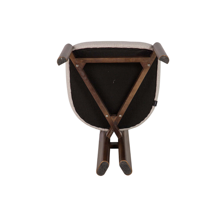 Underside view of Lina dining chair showing frame construction