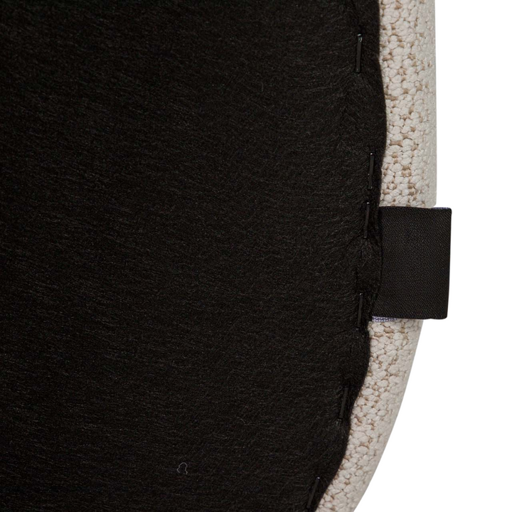 Underside of Lina dining chair seat with black fabric cover