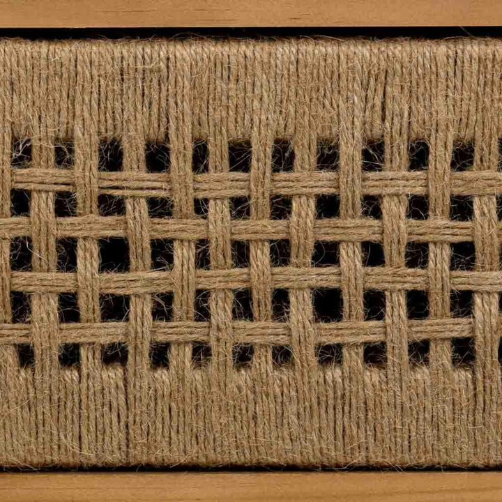 Close-up of the Madura bedside table highlighting the handwoven jute drawer front and geometric weave