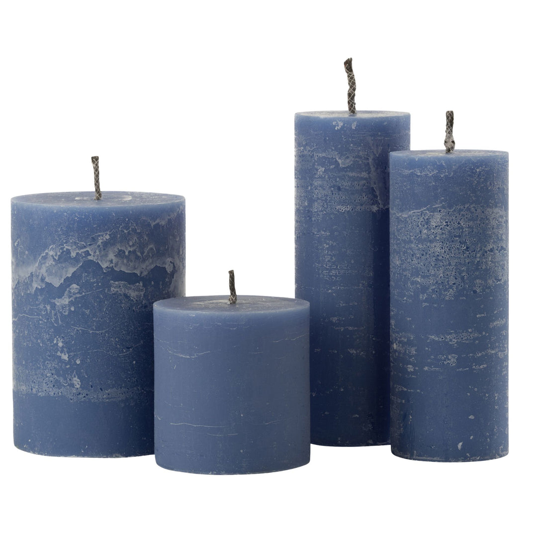 Front view of Mahé Blue Outdoor Candle set in assorted sizes.