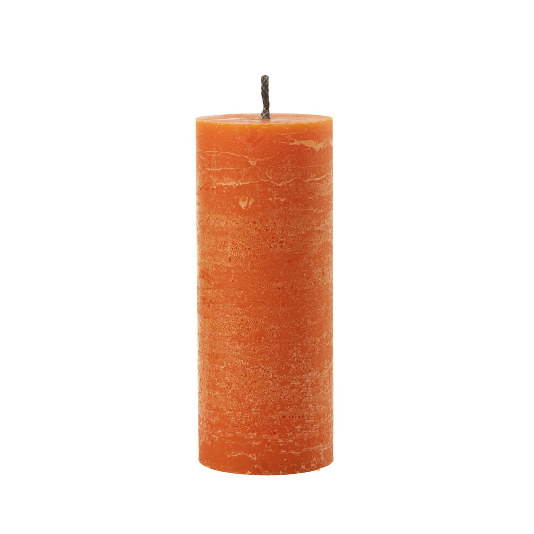 Medium-sized Mahe Orange Outdoor Candle with textured paraffin finish.