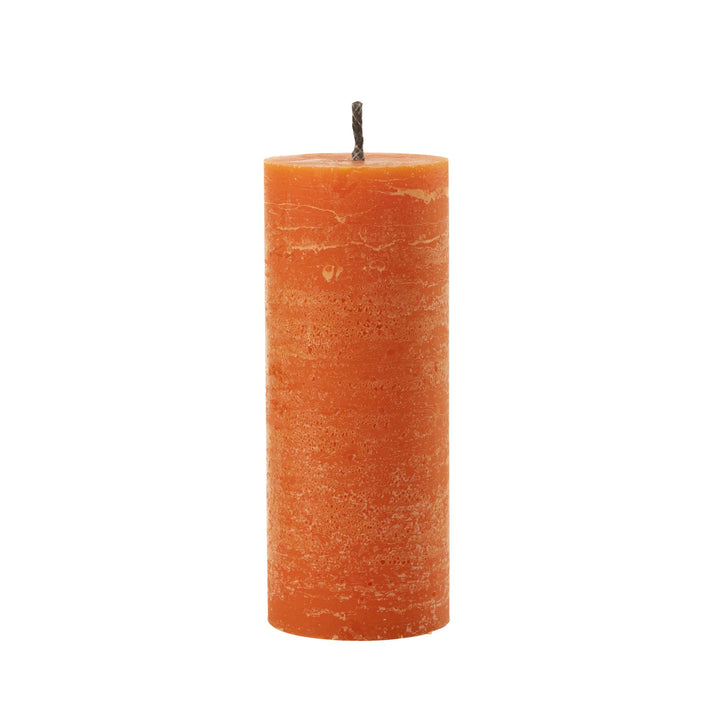 Medium-sized Mahe Orange Outdoor Candle with textured paraffin finish.