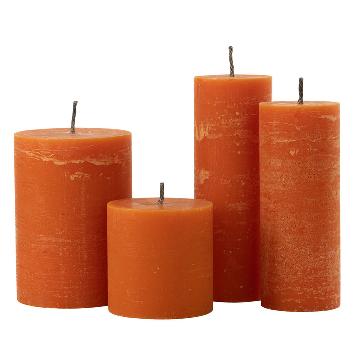Group view of Mahe Orange Outdoor Candles in assorted sizes and vibrant orange color.