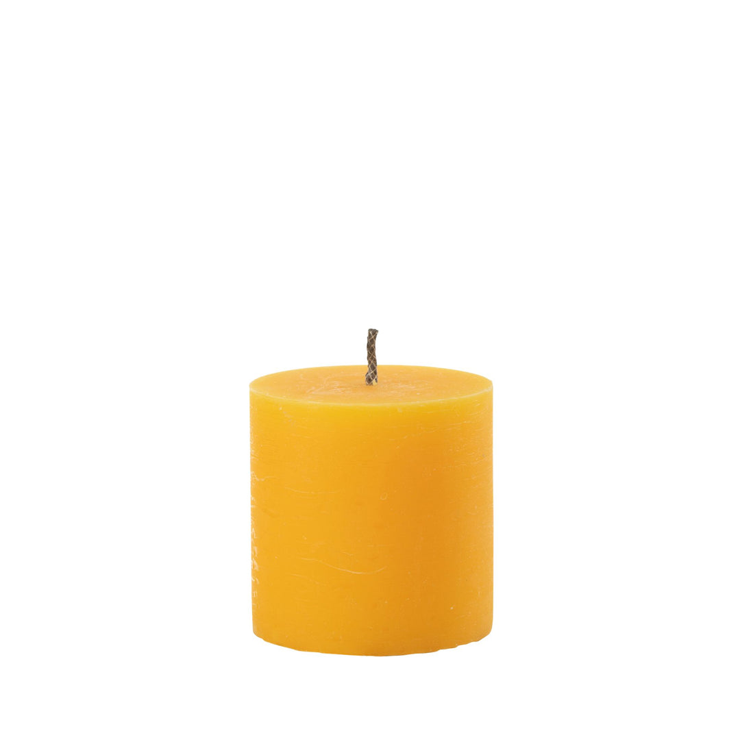 Extra Small Mahe Yellow Outdoor Candle with textured finish.