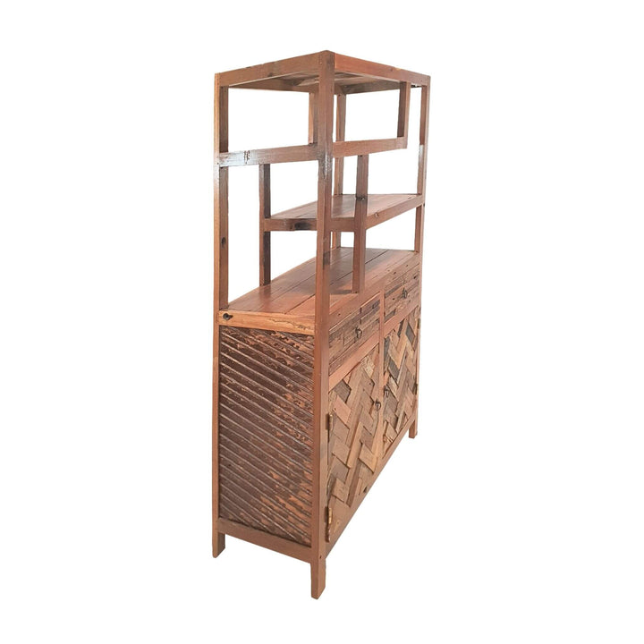 Angled view of reclaimed teak bookcase with herringbone cabinet doors