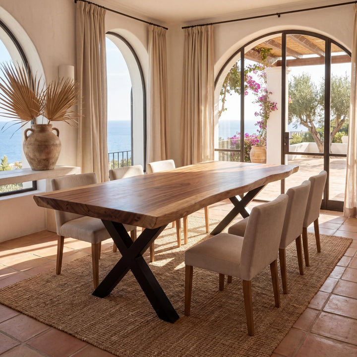 Styled interior dining setting featuring the Makai suar wood table with a sculptural black metal base.