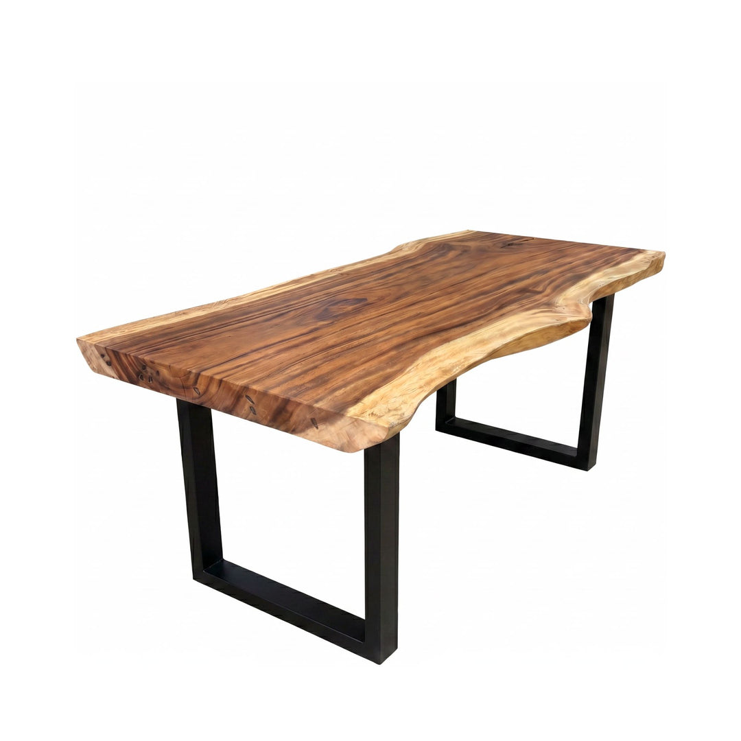 Front angled view of the dining table highlighting its solid suar wood top and black metal U-shaped base.