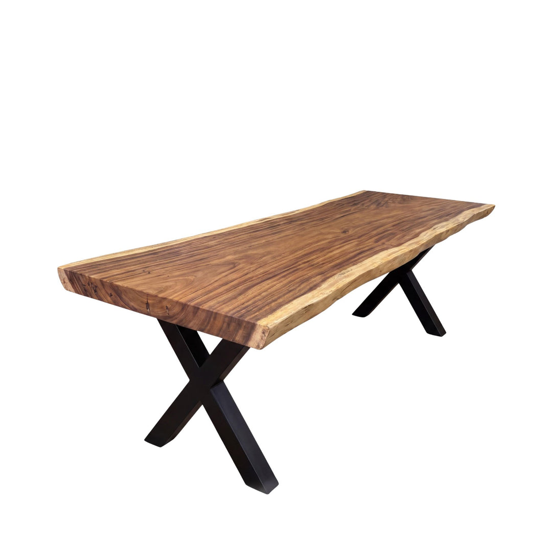 Front view of the Makai table showing the natural wood grain and X-shaped black metal support.