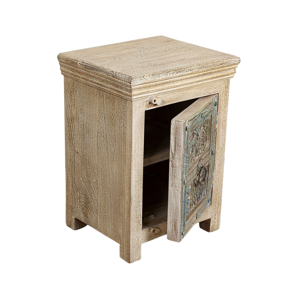 Angled view of the Makole bedside table with the door open, revealing interior storage and aged wood texture.