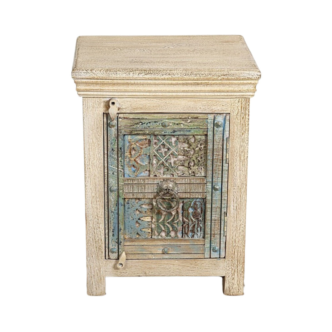 Front view of the Makole bedside table showcasing its reclaimed wood structure and carved decorative door.