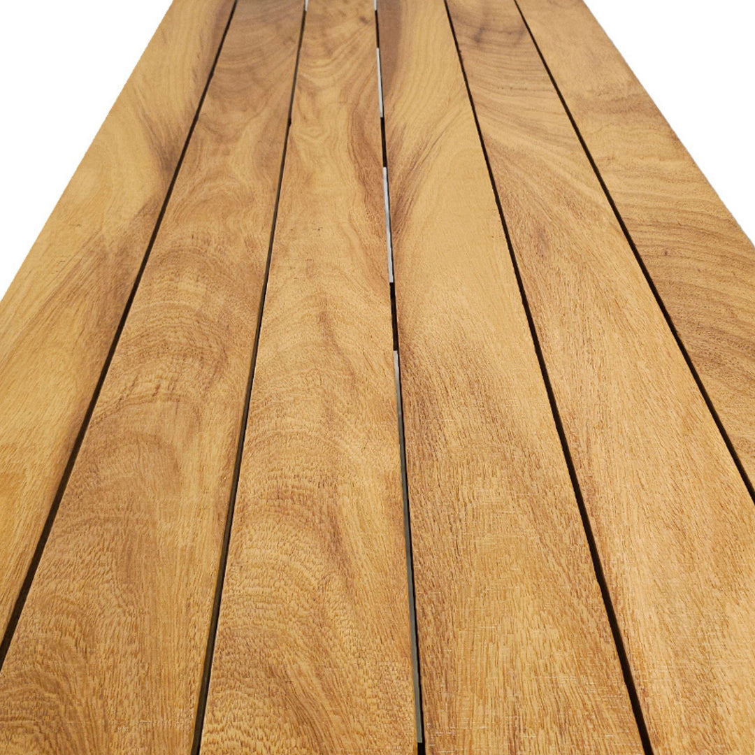 Close-up detail of the iroko wood tabletop highlighting natural grain, texture, and warm tones.