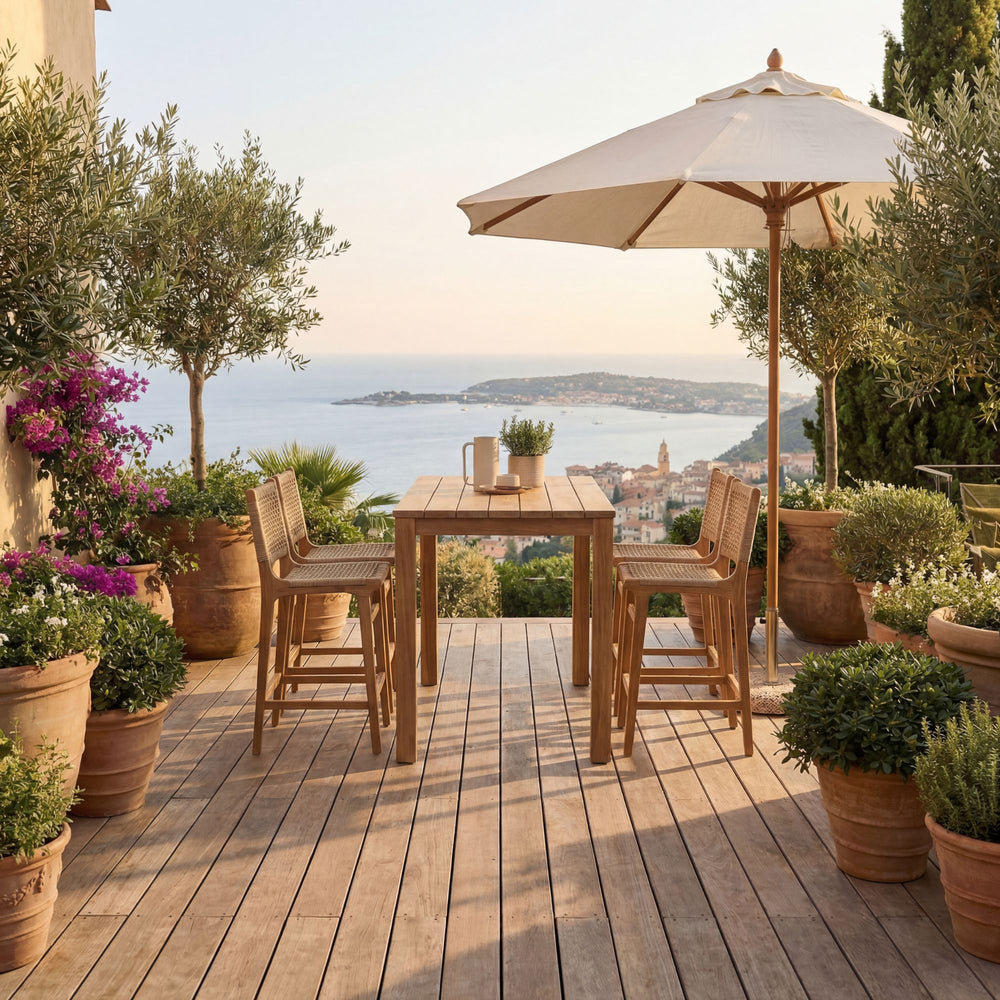 Outdoor terrace setting featuring the Maldives bar table under a covered pergola.