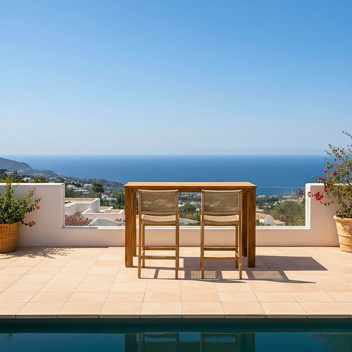 Poolside scene showing the Maldives bar table with coastal views.