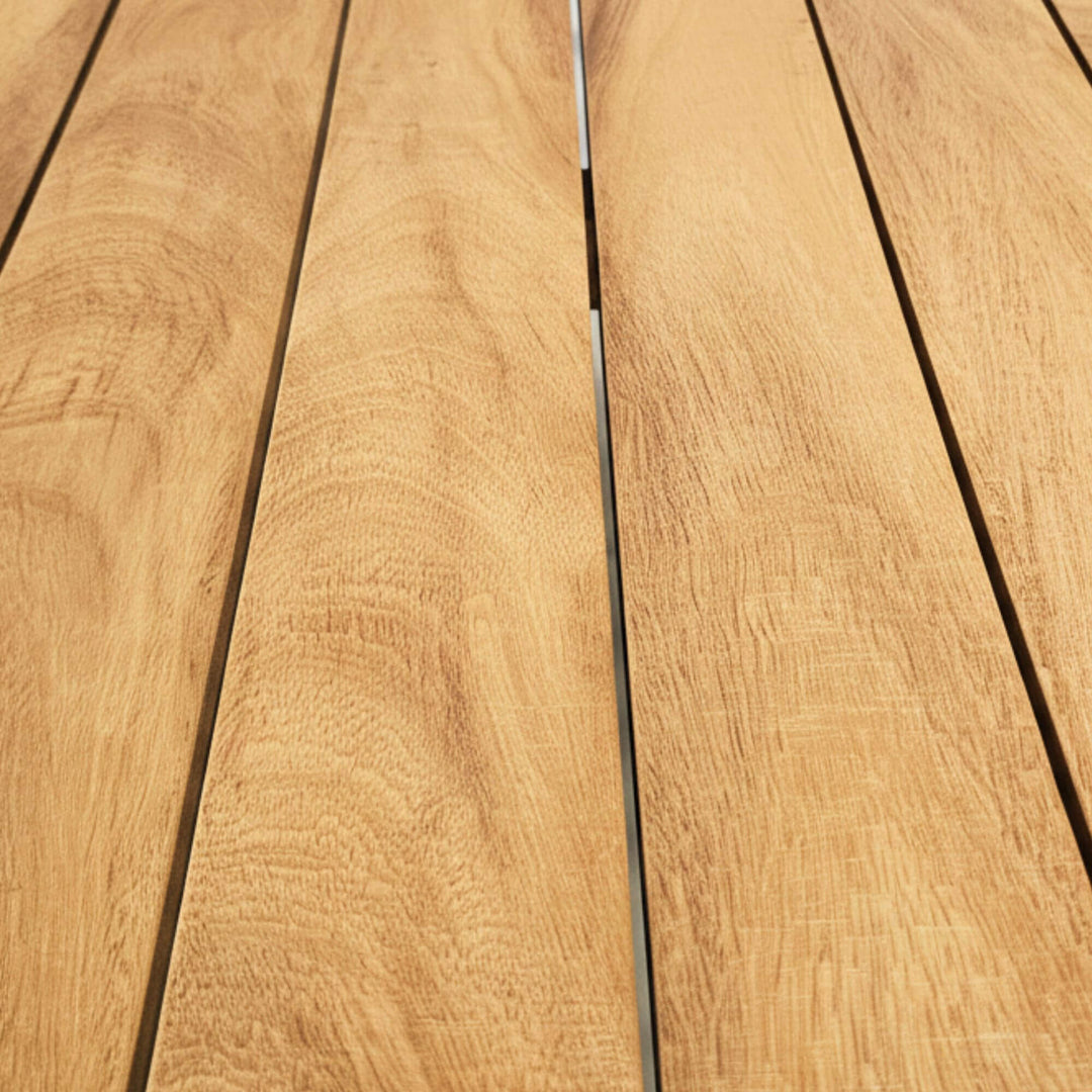 Close-up of the iroko wood grain and natural texture on the tabletop.