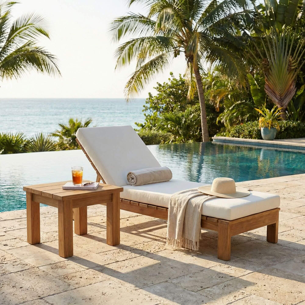 Styled outdoor poolside setting featuring the Maldives side table beside a sun lounger.