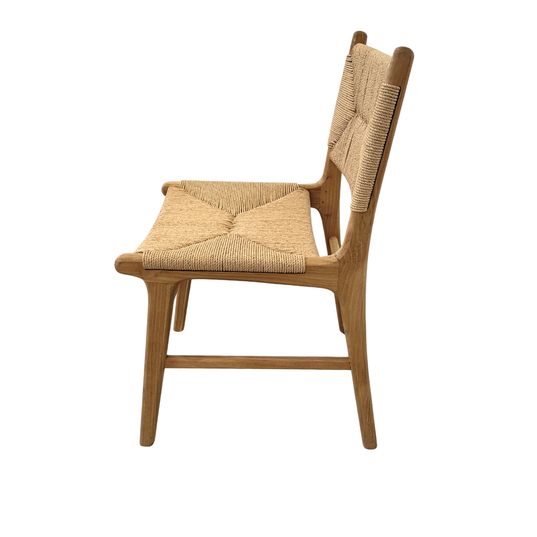 Side profile of teak dining chair highlighting slim silhouette