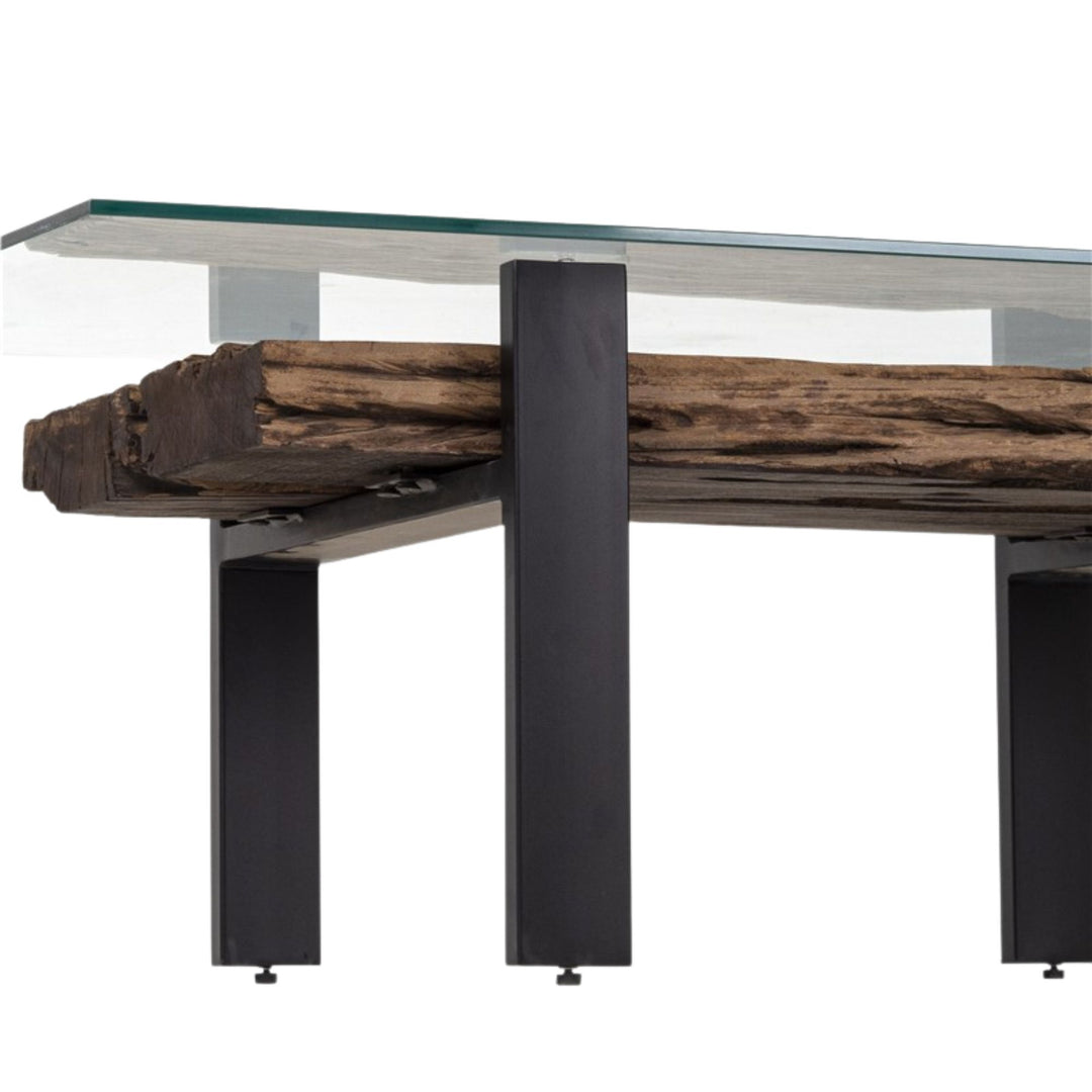 Close-up detail of the reclaimed wood texture visible beneath the glass top.