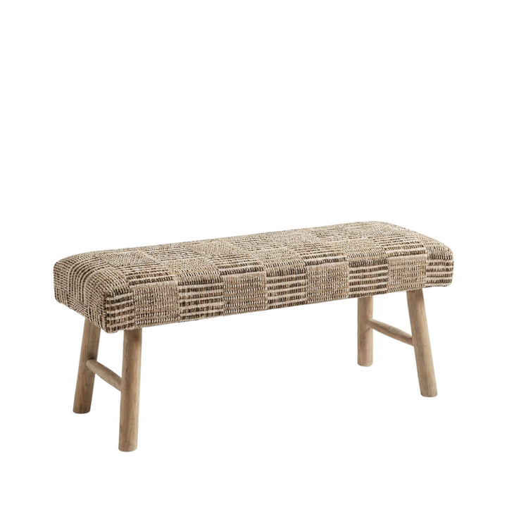 Front view of the Malvan bench showcasing its woven jute and cotton seat and solid wood legs.