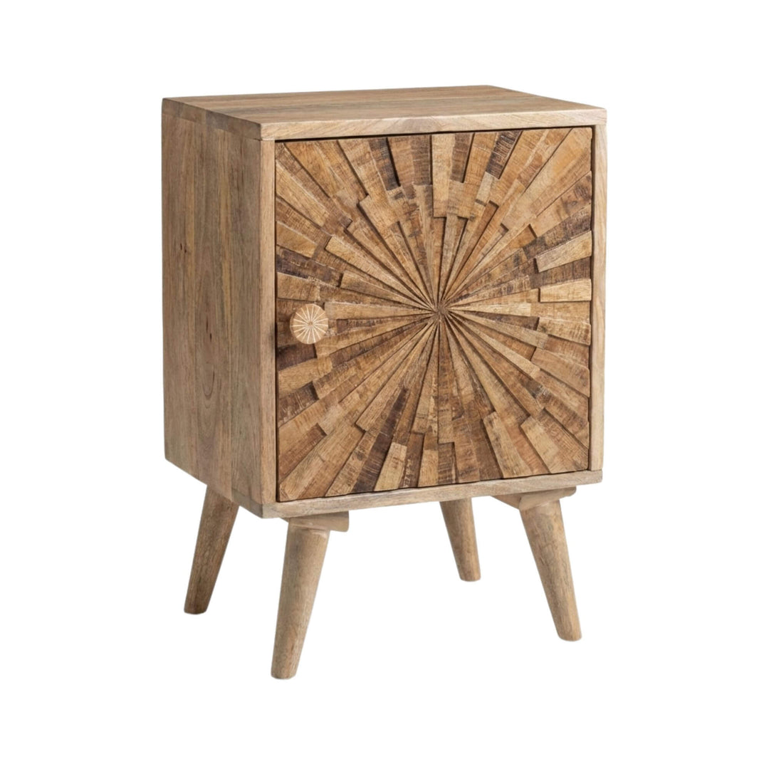 Front view of the Mandalay bedside table made from mango wood with a carved sunburst pattern.