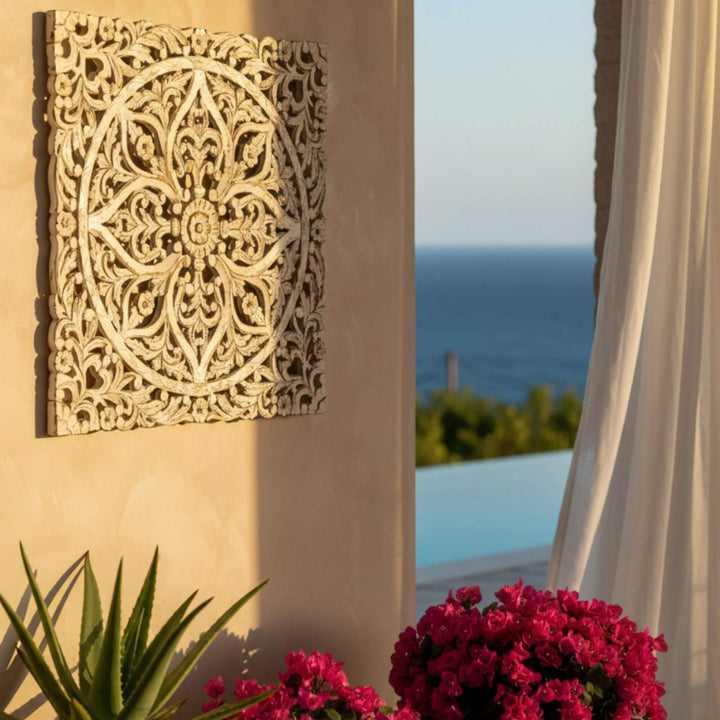 Outdoor terrace view with the mandala panel in a Mediterranean-style setting.