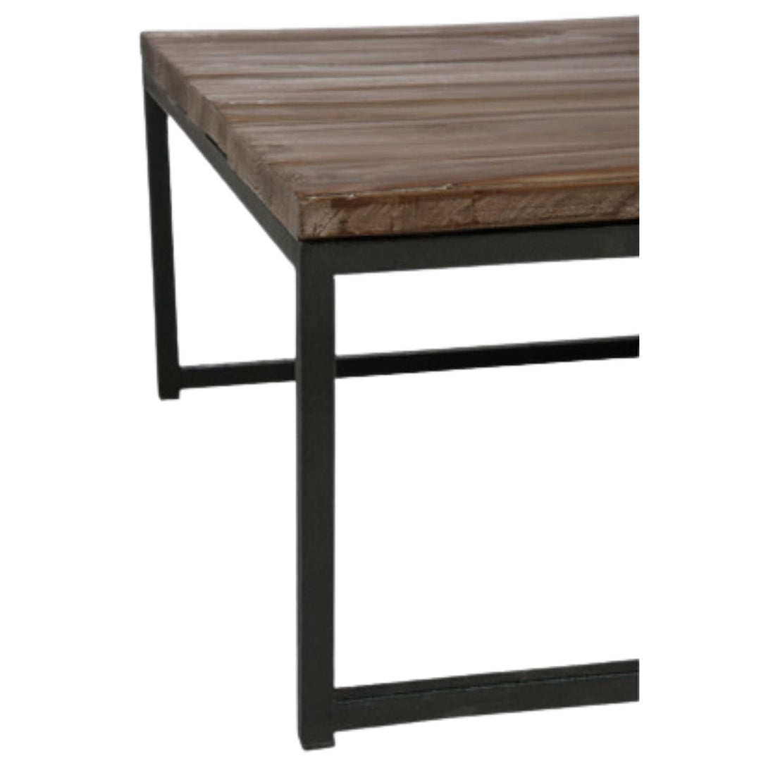 Side view showing the slim black iron frame and mango wood top.