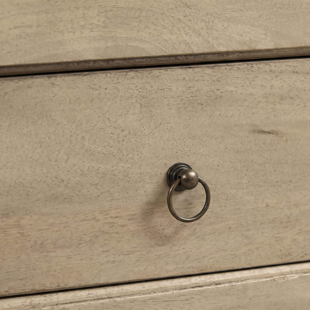 Close-up of the Mango TV console showing its natural wood texture and metal ring drawer pull