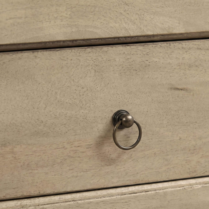 Close-up of the Mango TV console showing its natural wood texture and metal ring drawer pull