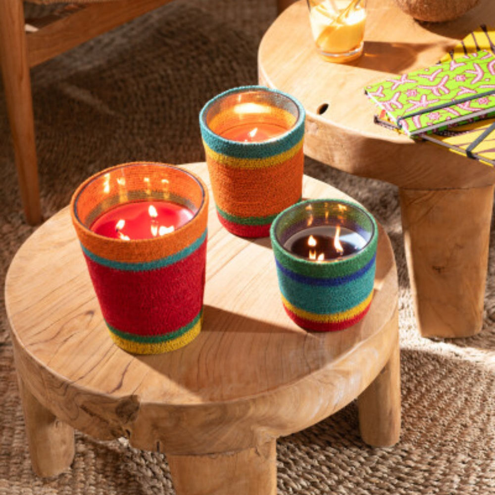 Styled interior scene with Marion Candles arranged on a rustic wooden table for warm ambient decor.