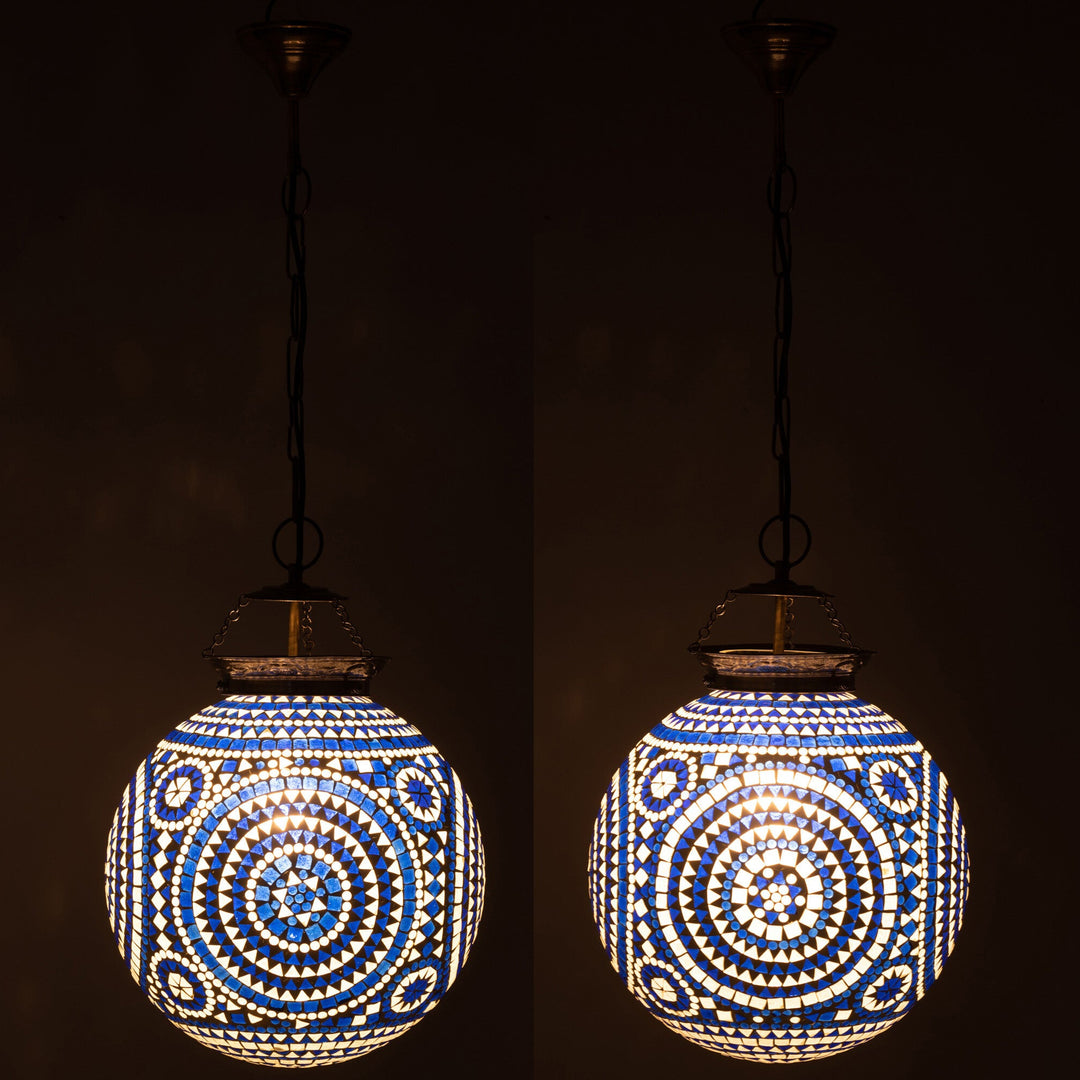 Marrakeash blue crystal mosaic ceiling lamp illuminated in a dark room.