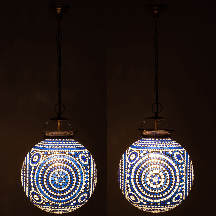 Marrakeash blue crystal mosaic ceiling lamp illuminated in a dark room.