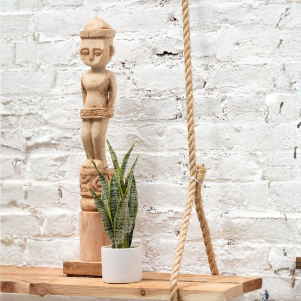 Masira deco stand displayed as a vertical sculptural accent in an interior setting.