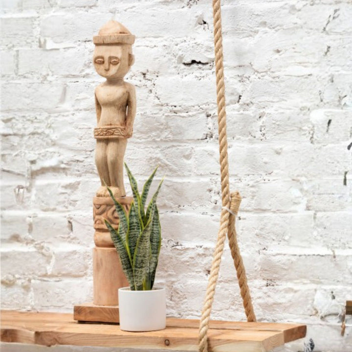 Masira deco stand displayed as a vertical sculptural accent in an interior setting.