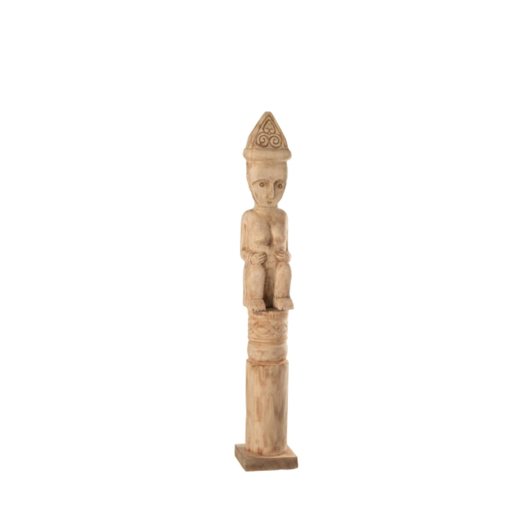 Side view highlighting the tall, slender silhouette of the Masira wooden figure.