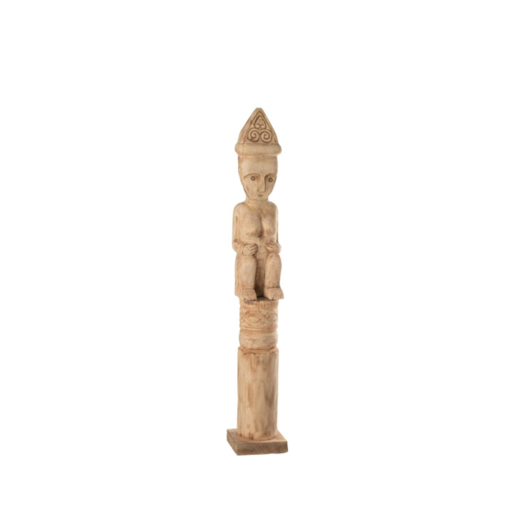 Side view highlighting the tall, slender silhouette of the Masira wooden figure.