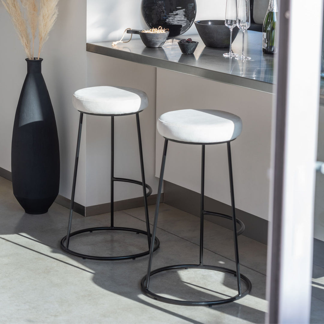 Styled interior view showing the tall black vase as a floor decorative accent.
