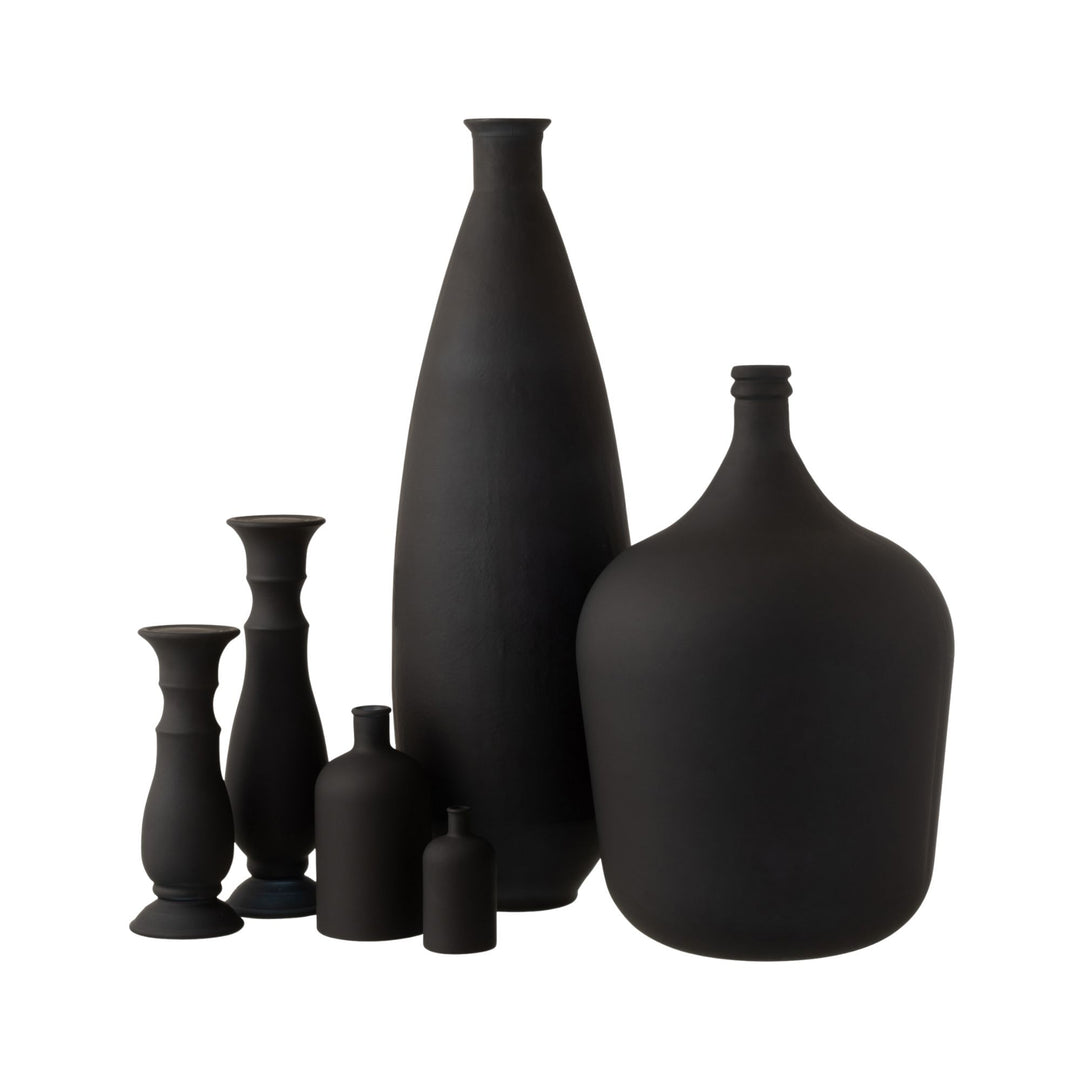 Grouped display of matte black glass vases highlighting the oval silhouette.