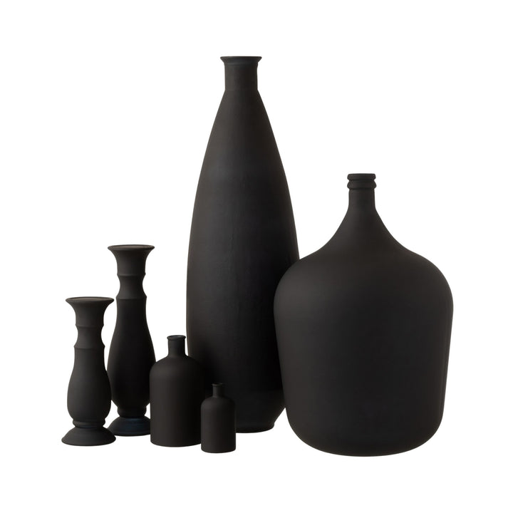 Grouped display of matte black glass vases highlighting the oval silhouette.