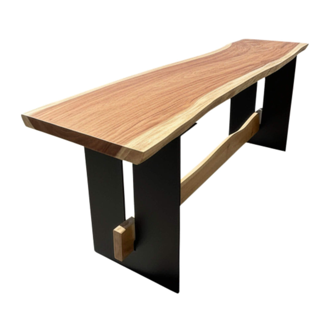 Front view of Maui suar wood bar table showcasing its live-edge top and black metal legs.