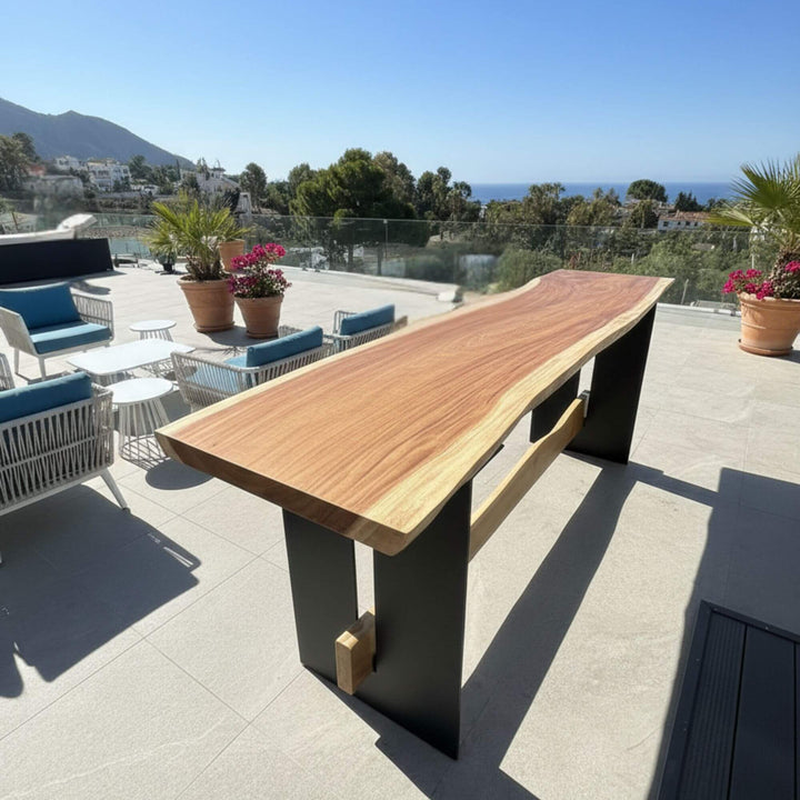 Maui Suar Wood bar table on a patio with a scenic view