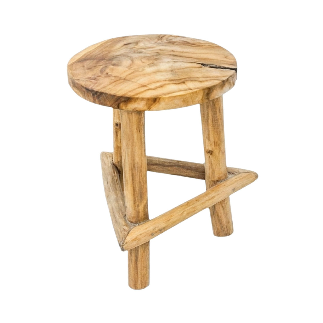 Front view of the Maupiti teak wood stool showcasing its round seat and solid wood construction.