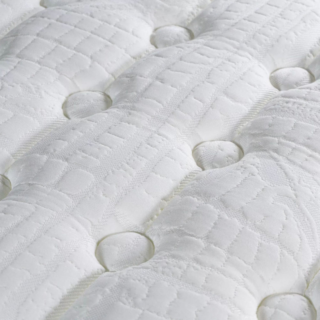 Close-up of the quilted surface emphasizing texture and comfort zones.