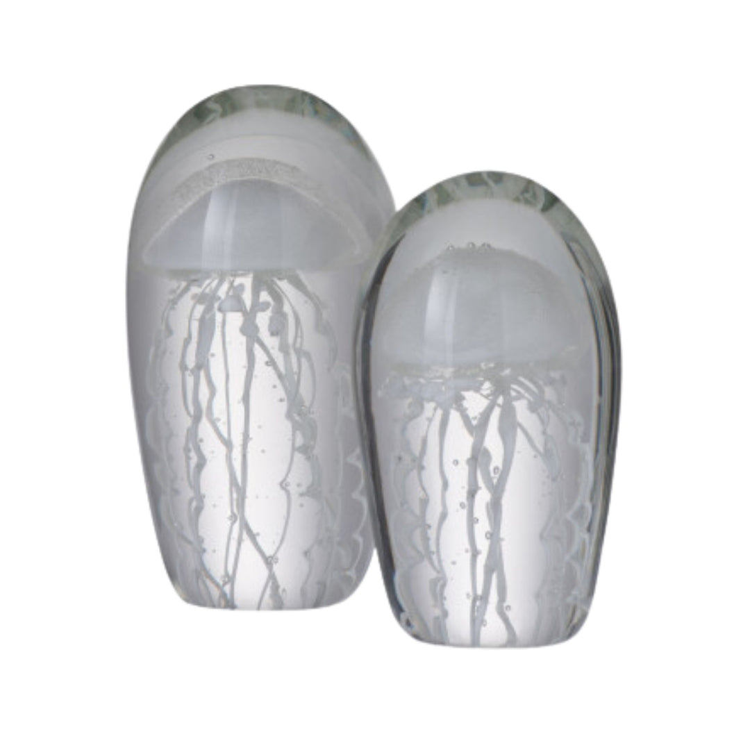 Side-by-side display of Medusa glass figures in different sizes showing organic jellyfish-inspired shapes.