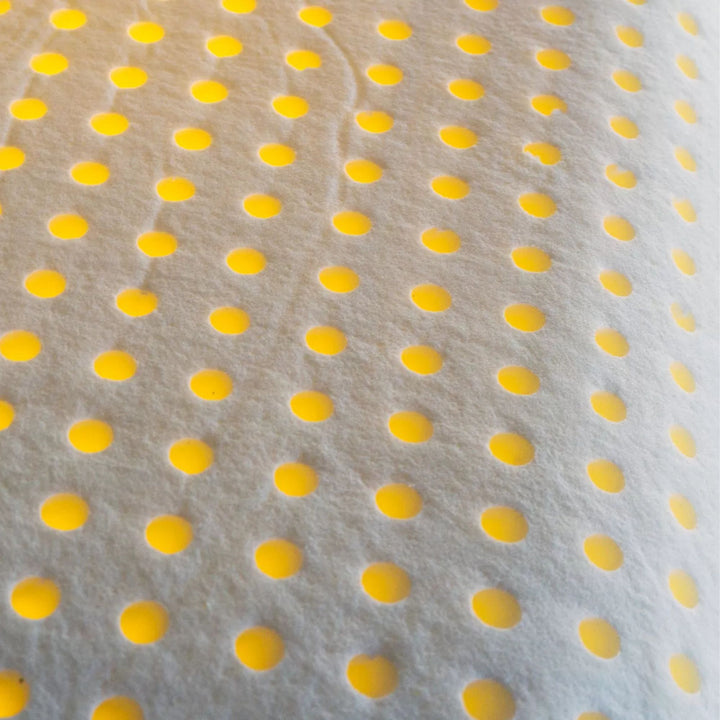 Close-up of the perforated memory foam core for enhanced airflow and adaptability.