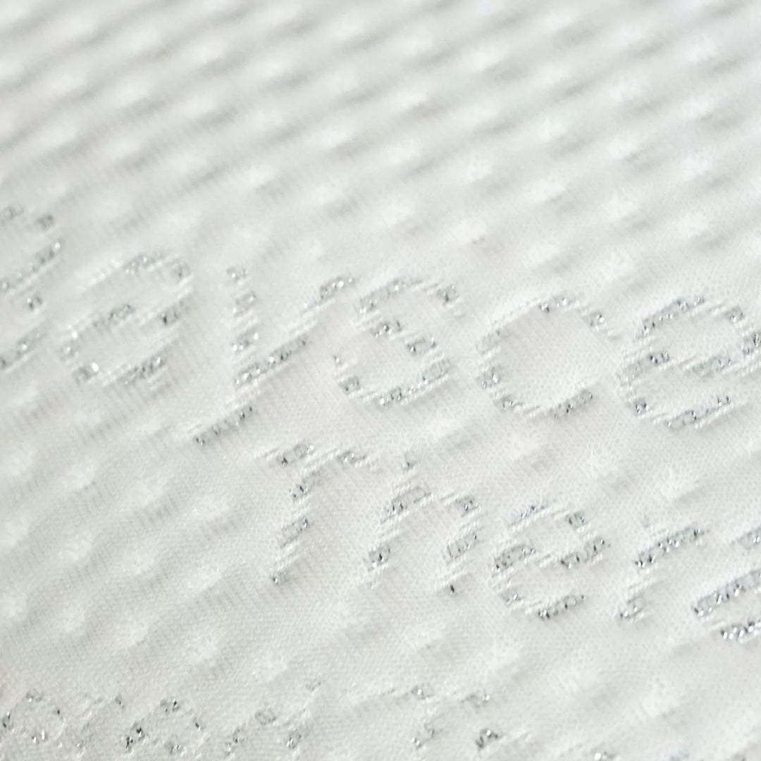 Detail of the removable TENCEL™ cover with soft, breathable texture.