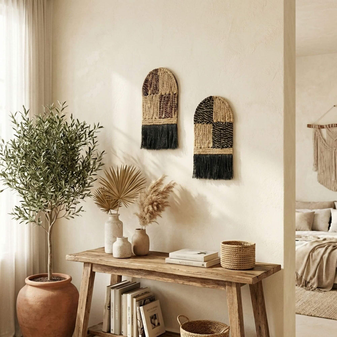 Nest interior design with woven Merak wall art, wooden console table, and plants.
