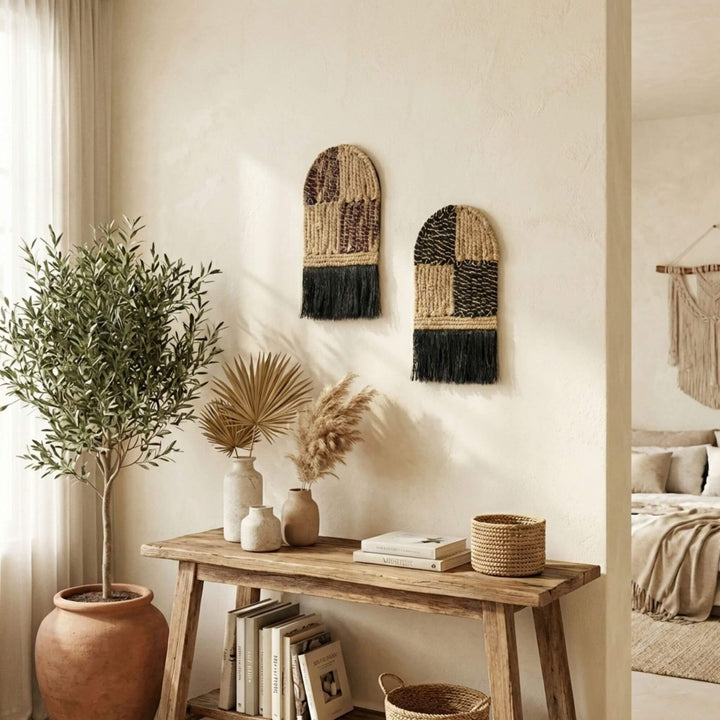 Nest interior design with woven Merak wall art, wooden console table, and plants.