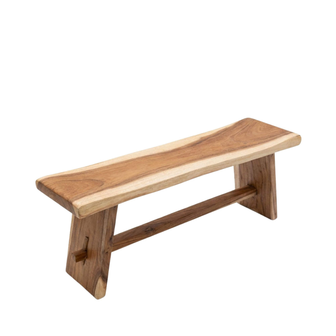 Angled view of the Midas suar wood bench showcasing its solid structure and natural live-edge seat.