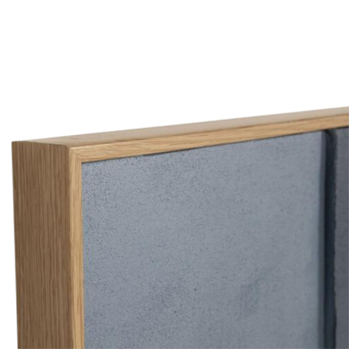 Close-up detail of the pine wood frame and painted canvas texture.